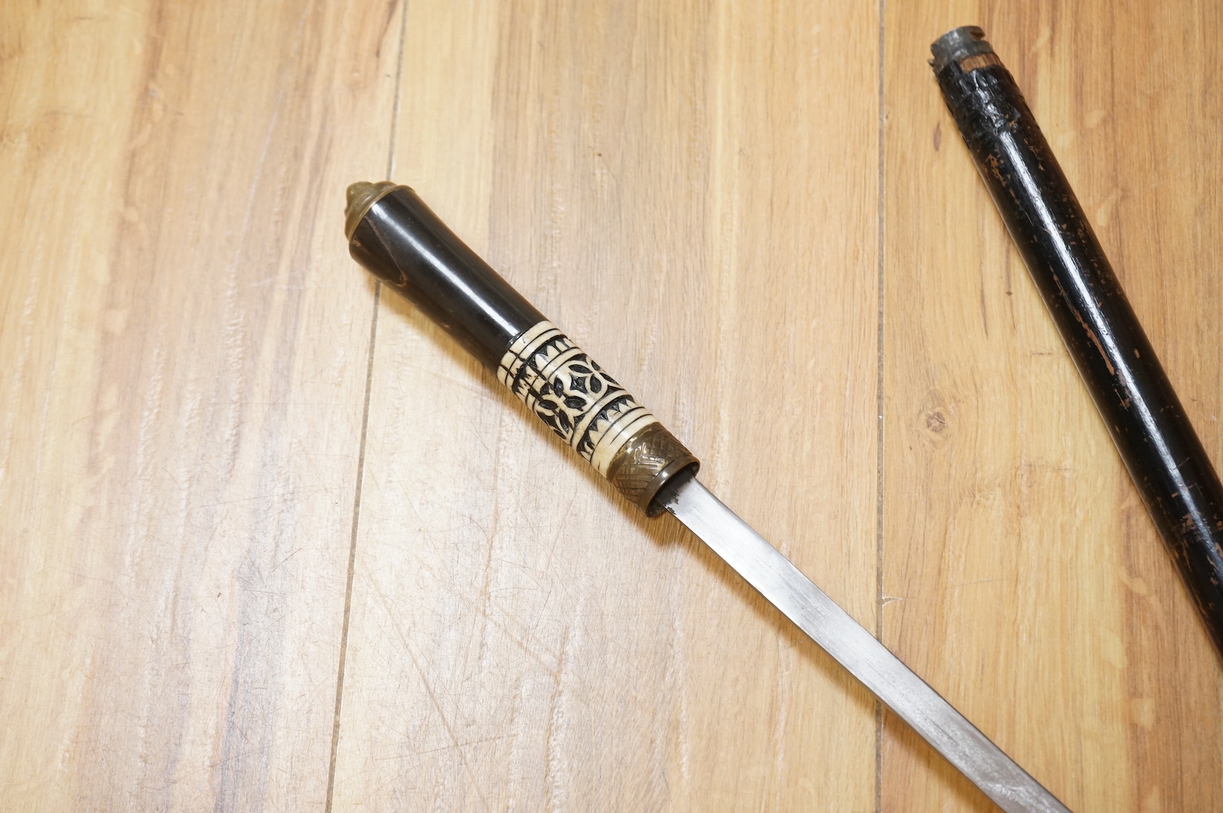 An early 20th century Indonesian sword stick with bone inlay, 92cm in length